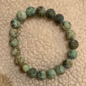 Men’s raw light turquoise color beads.